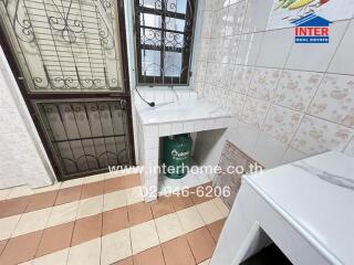 Utility room with storage space and security windows