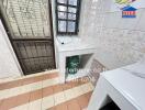 Utility room with storage space and security windows