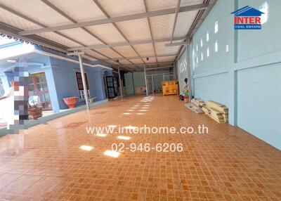 Spacious covered outdoor area with tiled flooring