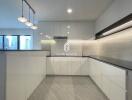 Modern kitchen with white cabinets and sleek design