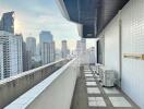 City view from spacious balcony of high-rise apartment