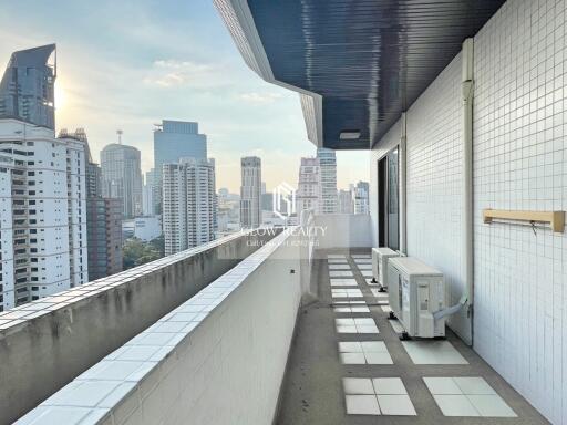 City view from spacious balcony of high-rise apartment