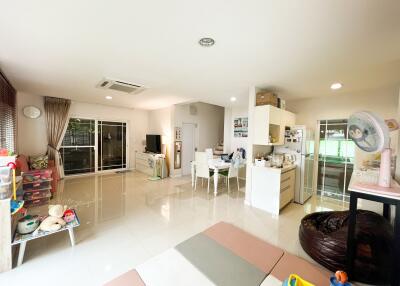 Spacious living room with dining area and kitchen