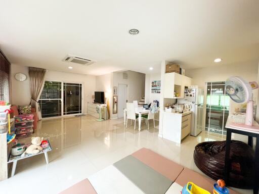 Spacious living room with dining area and kitchen