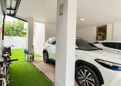 Covered garage with parked cars