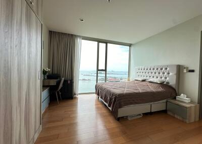 Bedroom with large windows and sea view