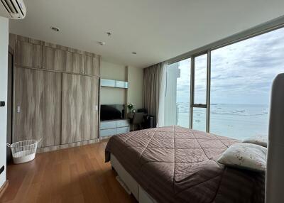 Bedroom with a large window overlooking the sea