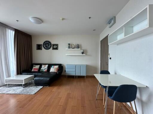 Modern living room with contemporary furniture and wooden flooring