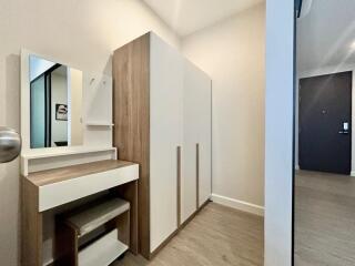 Modern bedroom with wooden furniture and a vanity