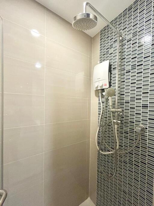 Modern shower with tiled wall