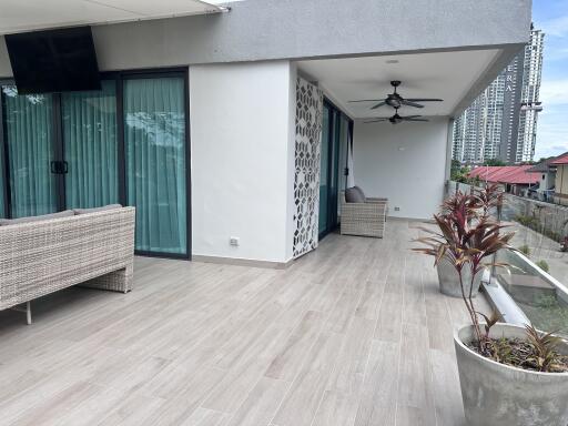 Spacious balcony with seating area and modern decor