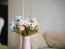 Vase with flowers on a coffee table in a living room