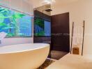 Modern bathroom with freestanding tub and walk-in shower