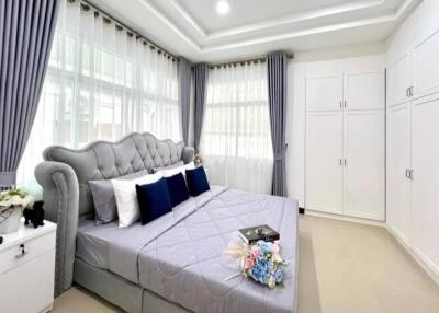 Spacious bedroom with large bed and ample natural light