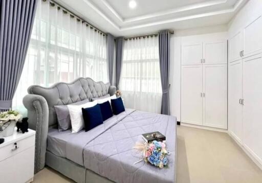 Spacious bedroom with large bed and ample natural light