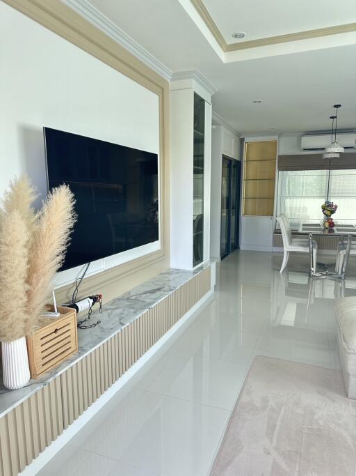 Modern living room with TV and dining area
