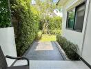 Outdoor patio with greenery and seating