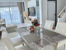 Modern dining room with marble table and upholstered chairs