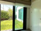 Bedroom with sliding glass door leading to a garden