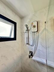 Modern bathroom with a shower and small window