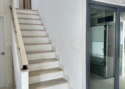 Modern staircase with glass door