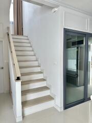 Modern staircase with glass door