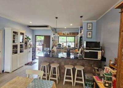 Modern kitchen with breakfast bar and dining area