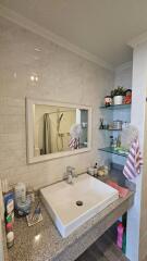 Modern bathroom with white subway tile wall and large countertop