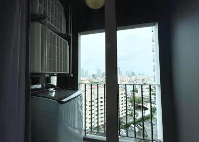 Laundry area with a window view