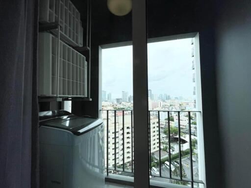 Laundry area with a window view