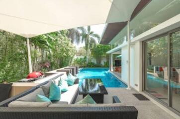 Outdoor seating area with poolside view