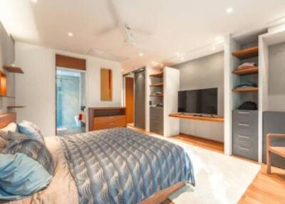 Modern bedroom with built-in storage and en-suite bathroom