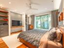 Spacious bedroom with modern furnishings and garden view