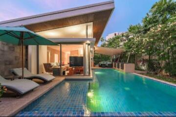 Modern villa with private swimming pool and lounge area