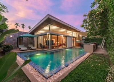 Modern house with pool at sunset