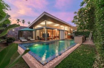 Modern house with pool at sunset