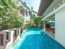 luxurious outdoor pool area with seating and modern design