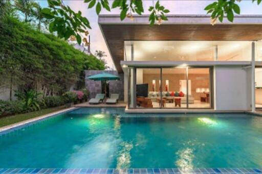 Modern house with swimming pool and patio.