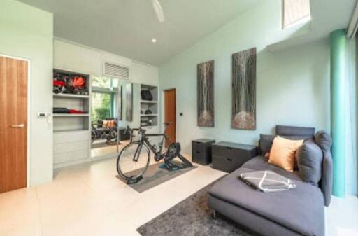 Modern living room with bicycle and chaise lounge