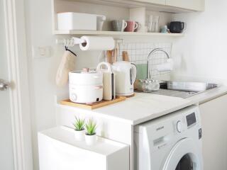 Modern kitchen with appliances and washing machine