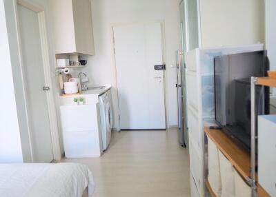 Compact studio apartment with essential appliances