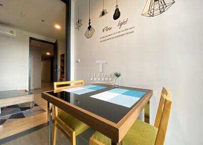 Modern dining area with stylish wall art and contemporary furniture