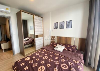 Stylish and modern bedroom with double bed and wardrobe