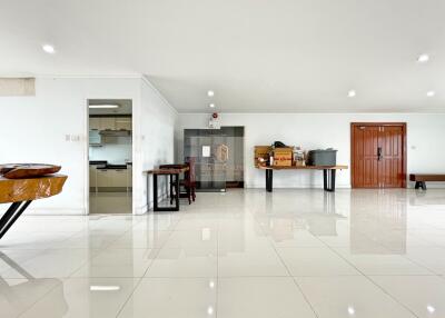 Spacious main living area with glossy tiled floor and modern amenities