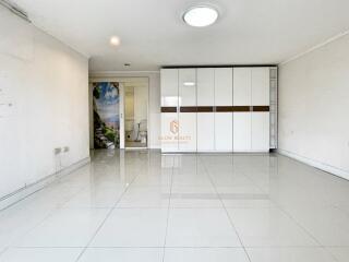 Spacious white bedroom with large wardrobe and ensuite bathroom