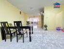 Dining area with table and chairs, open floor layout