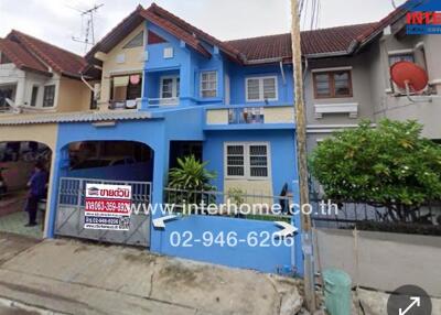 Front view of a blue residential house