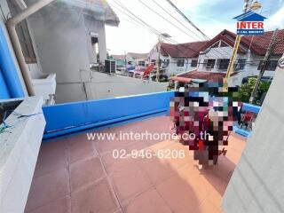 Outdoor balcony area with tiled floor