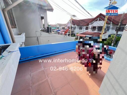 Outdoor balcony area with tiled floor