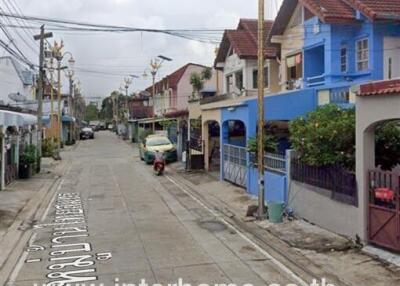 Street view of residential neighborhood with row houses